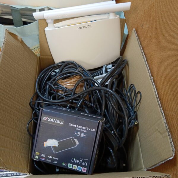 Box of cables & power supplies including sansui smart android TV 4.0