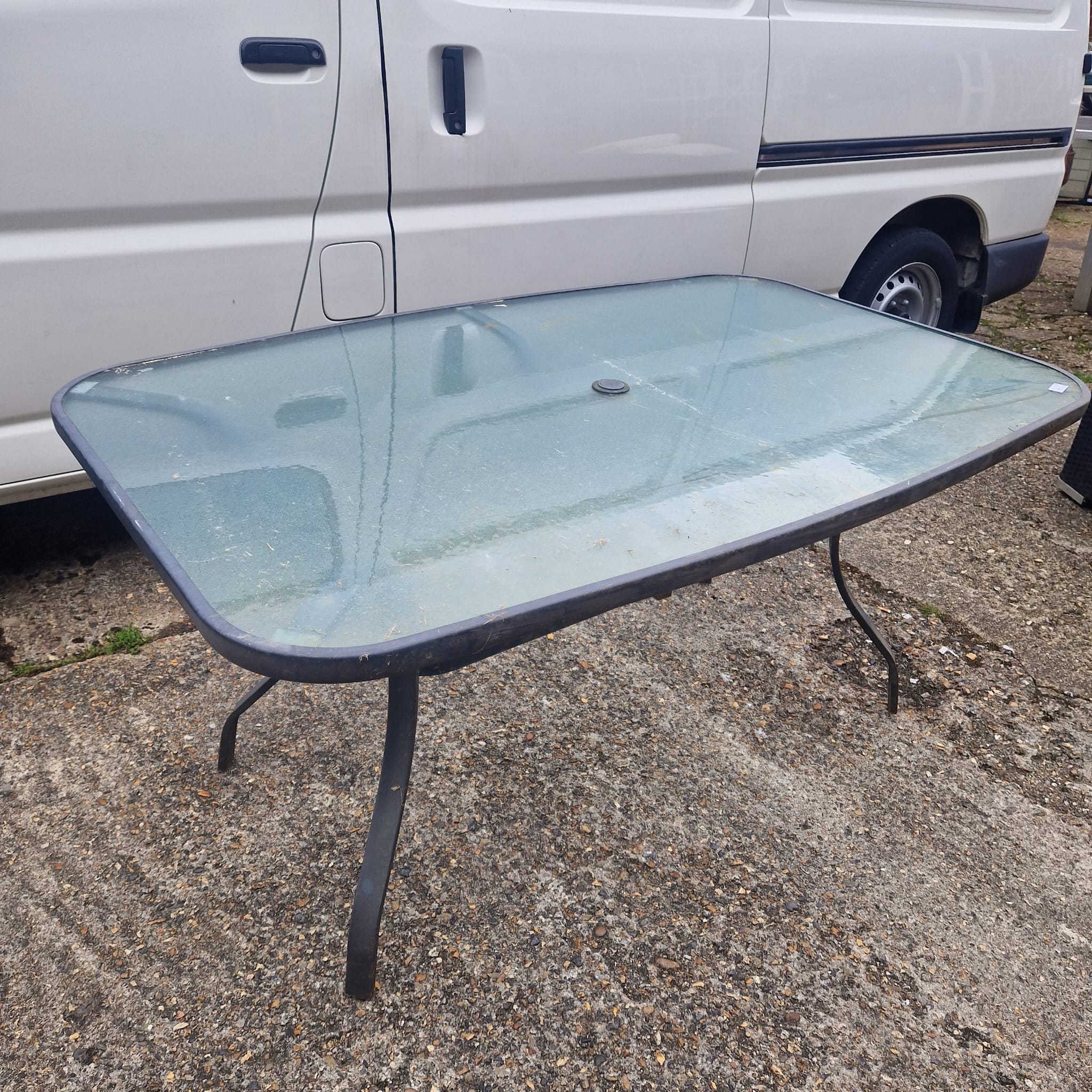 Large glass topped garden table