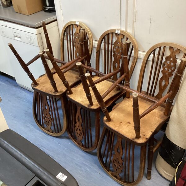 Six ercol wheelback dining chairs