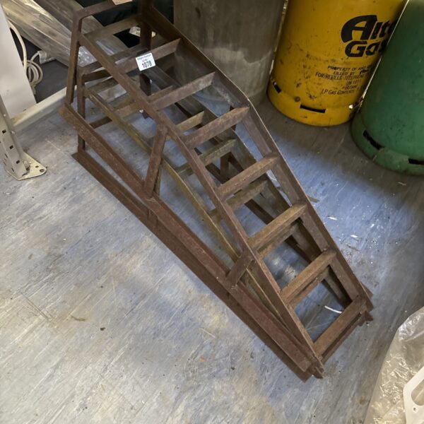 Two mechanics car ramps