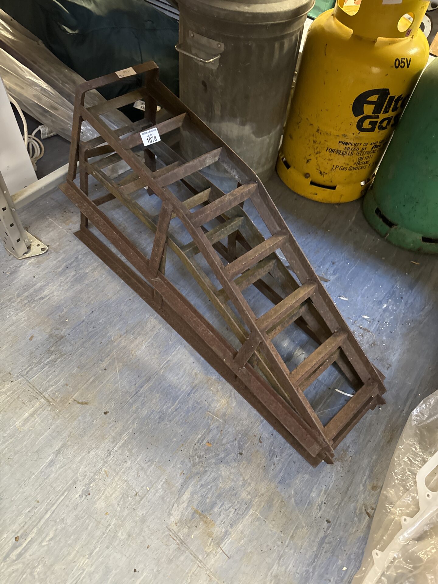 Two mechanics car ramps