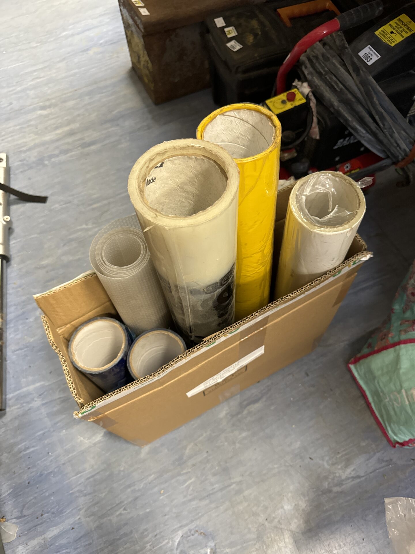 Six rolls of assorted floor protector