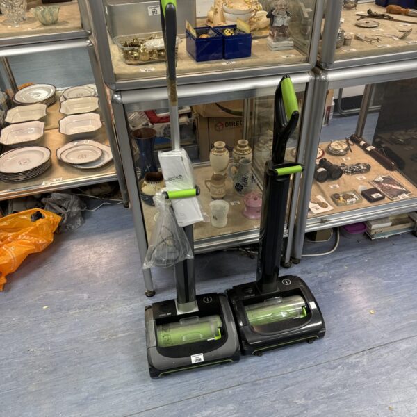 Two gtech cordless hoovers with one charger  - untested, handle repaired with tape on one