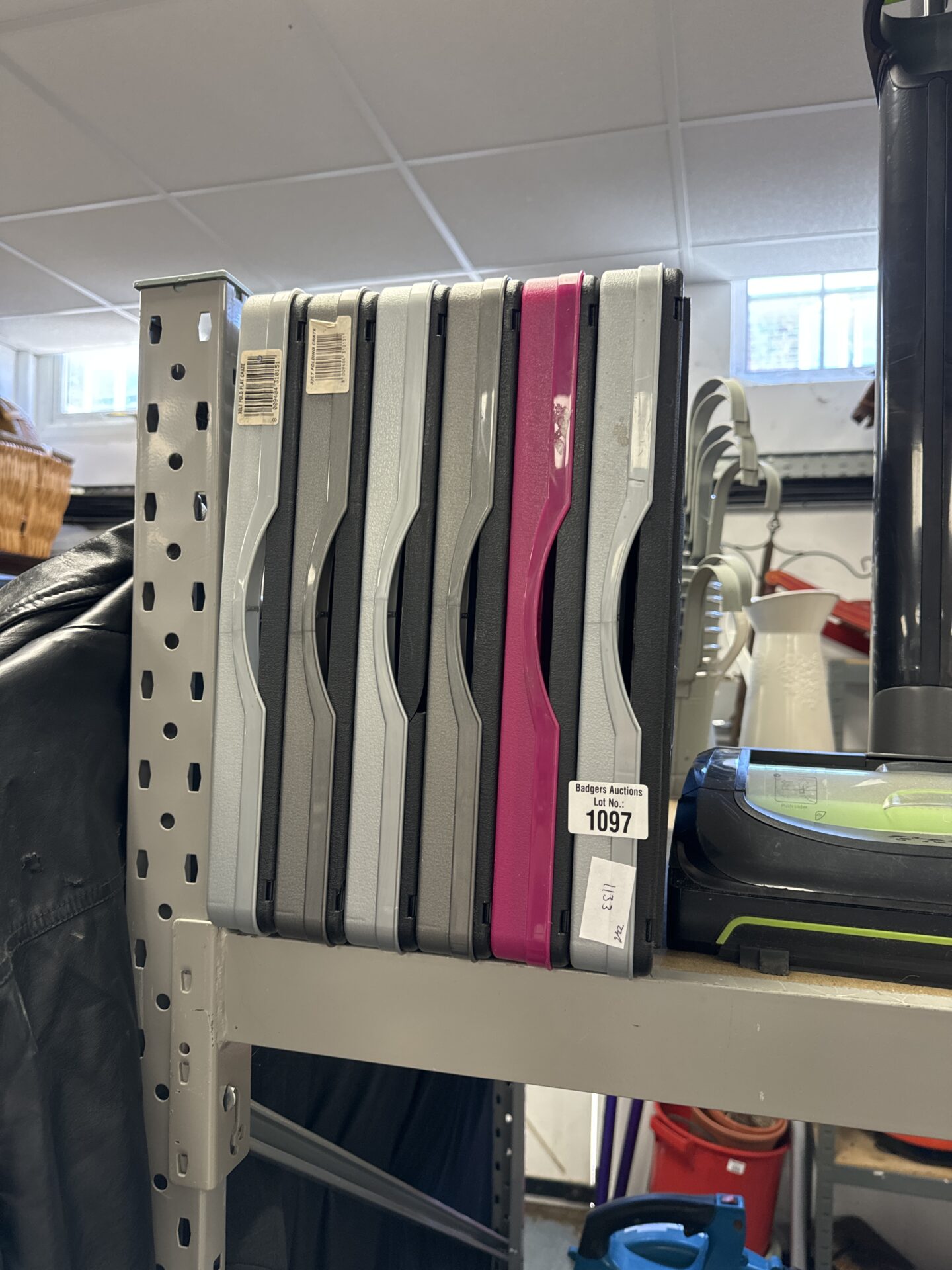 Six folding plastic storage crates