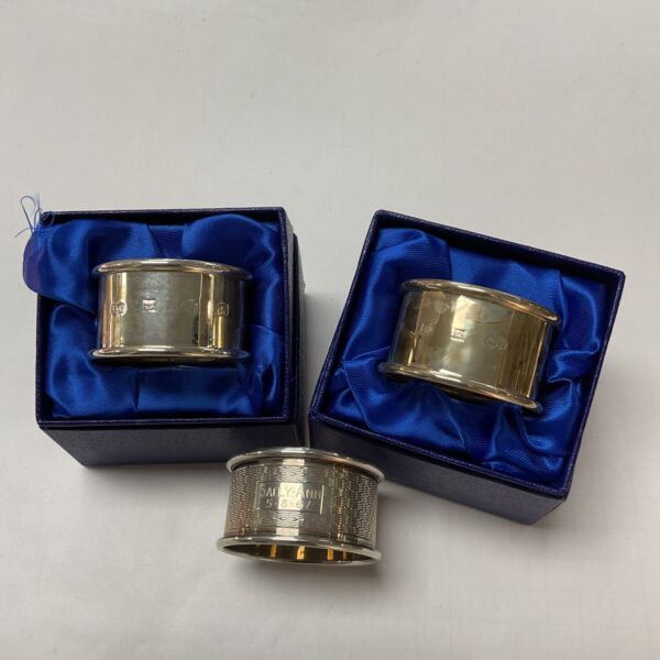 Two Hallmarked Silver Knapkin Rings and One loose 57.3g