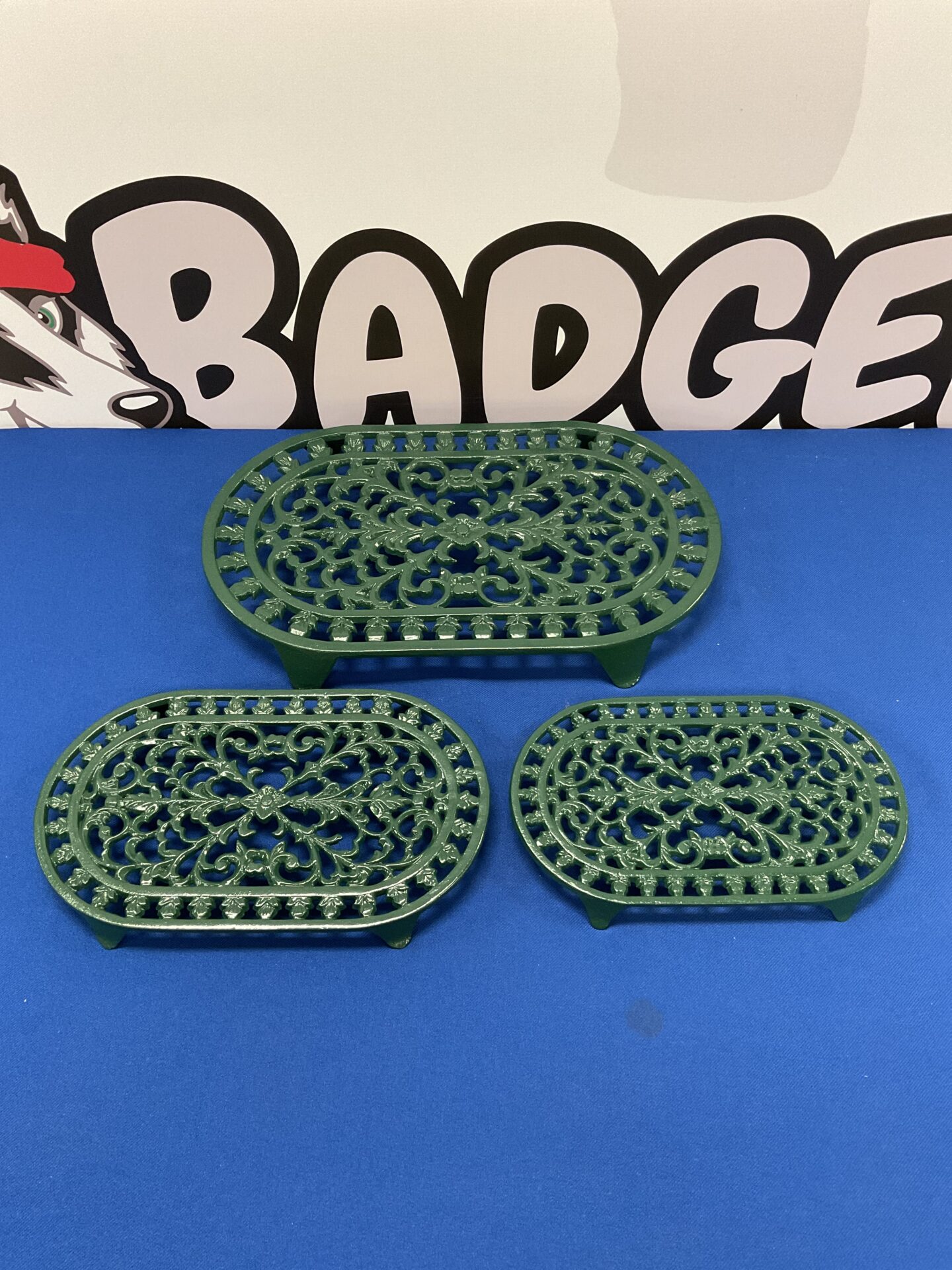 Three cast iron pot trivets