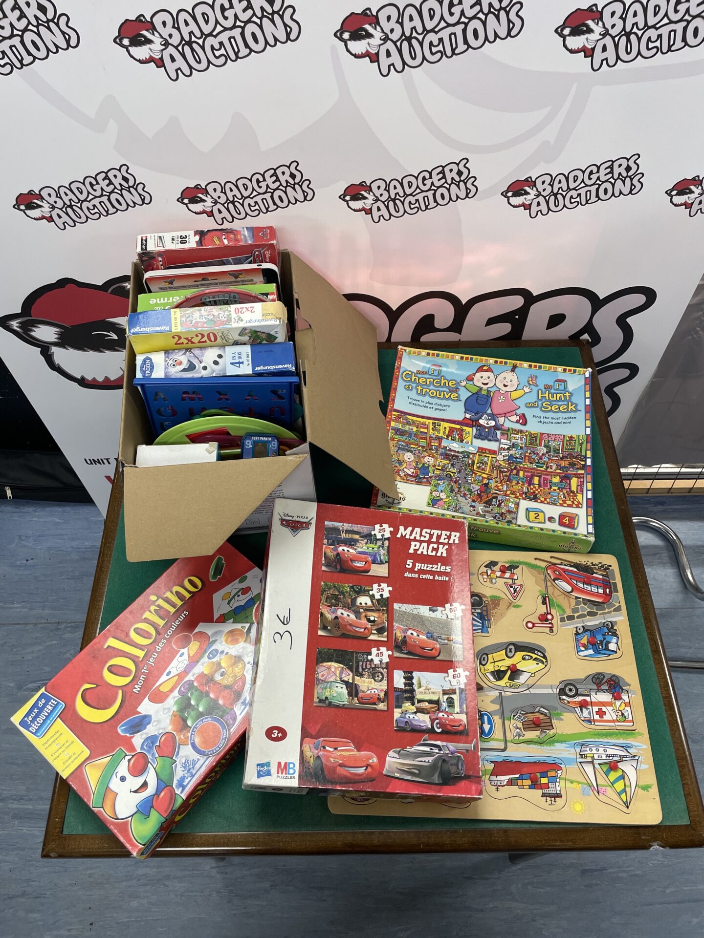 selection of mixed puzzles and games incl. ravensburger and hasbro mb puzzles