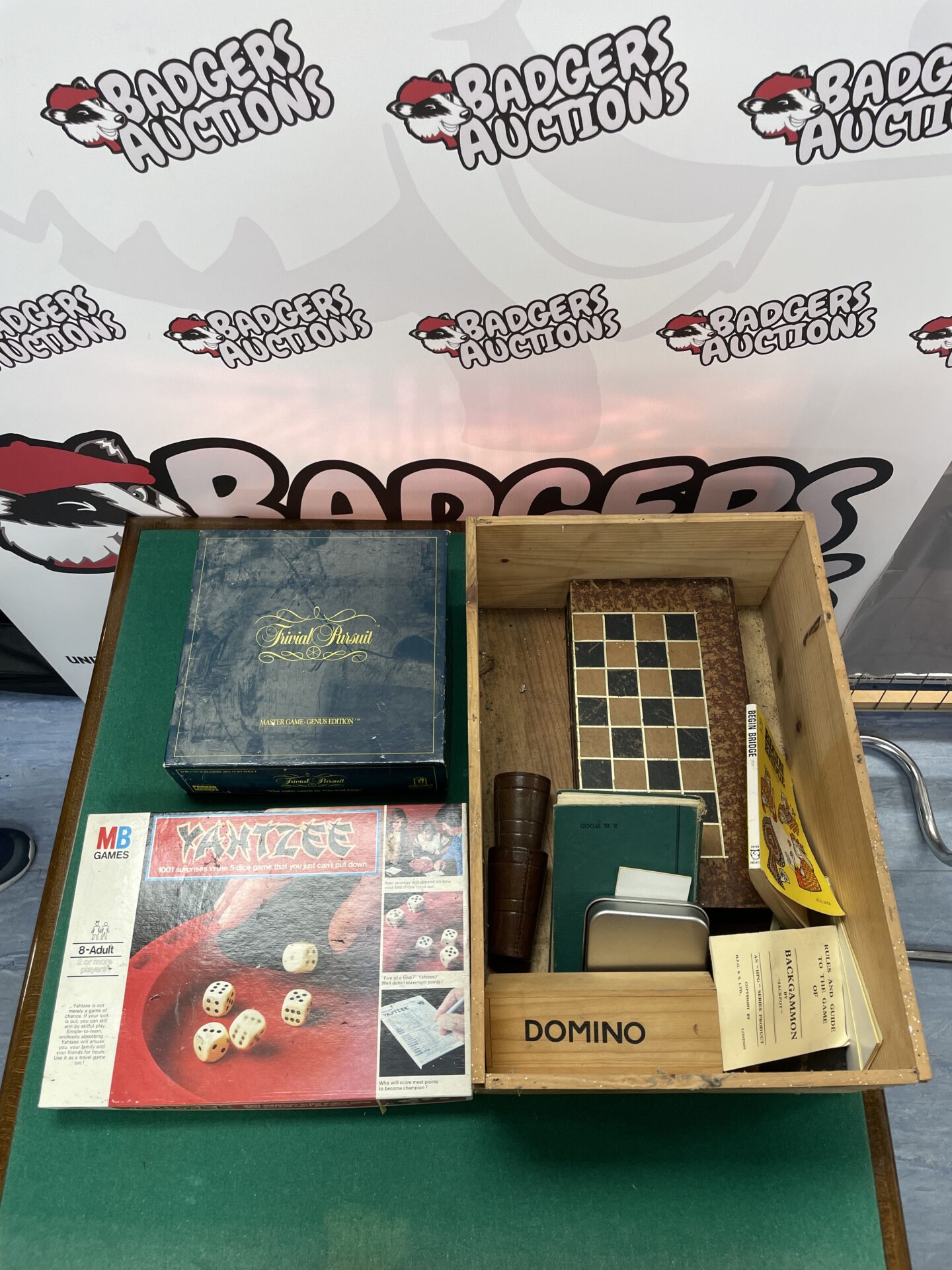 selection of vintage games incl. yahtzee, trivial pursuit, chessboard and dominoes