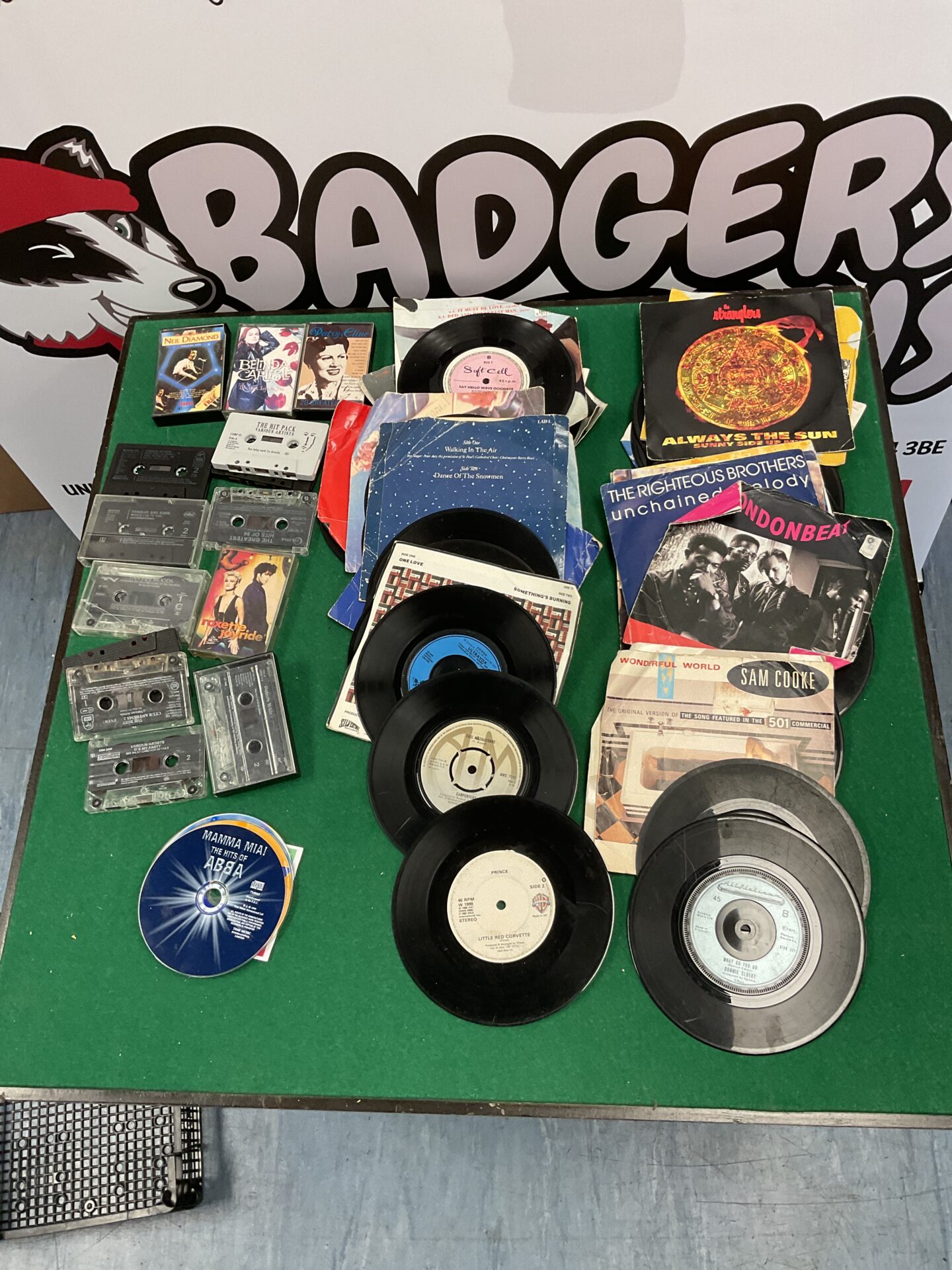 Tray of 7” vinyl and cassettes including Sam cooke