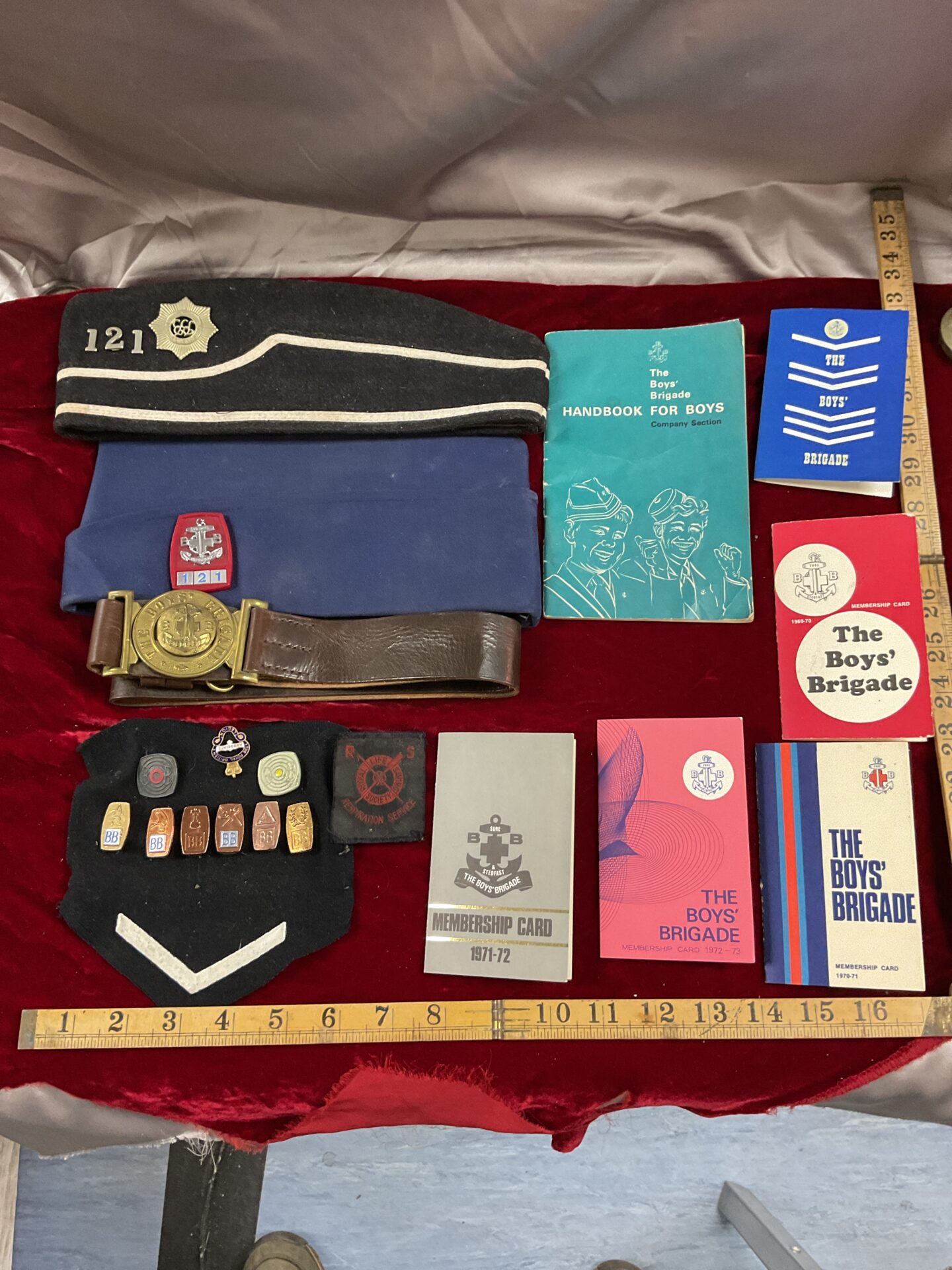 Collection of boys brigade hats belt badges and booklets