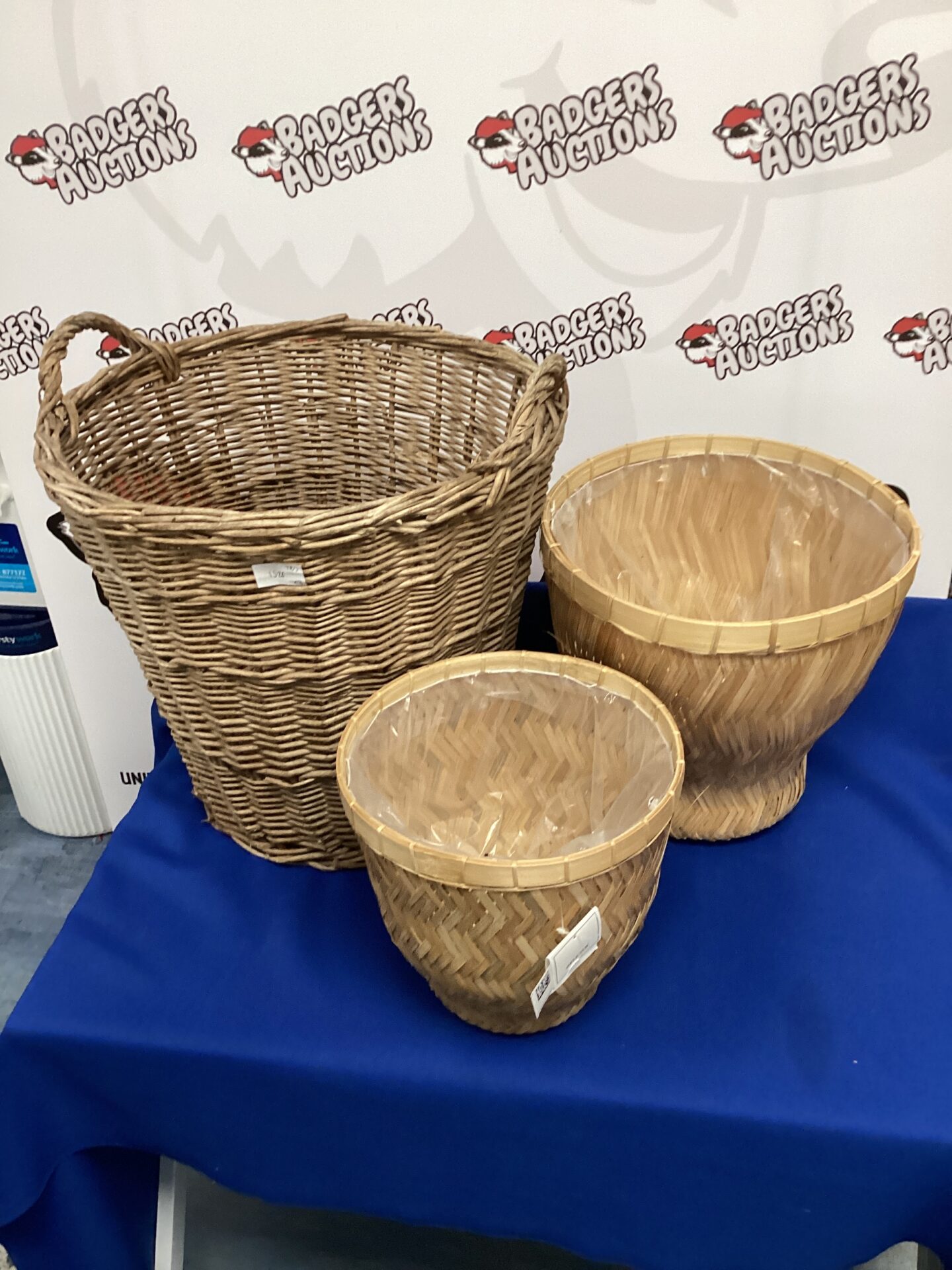 Set of baskets, two small wicker baskets and one laundry basket
