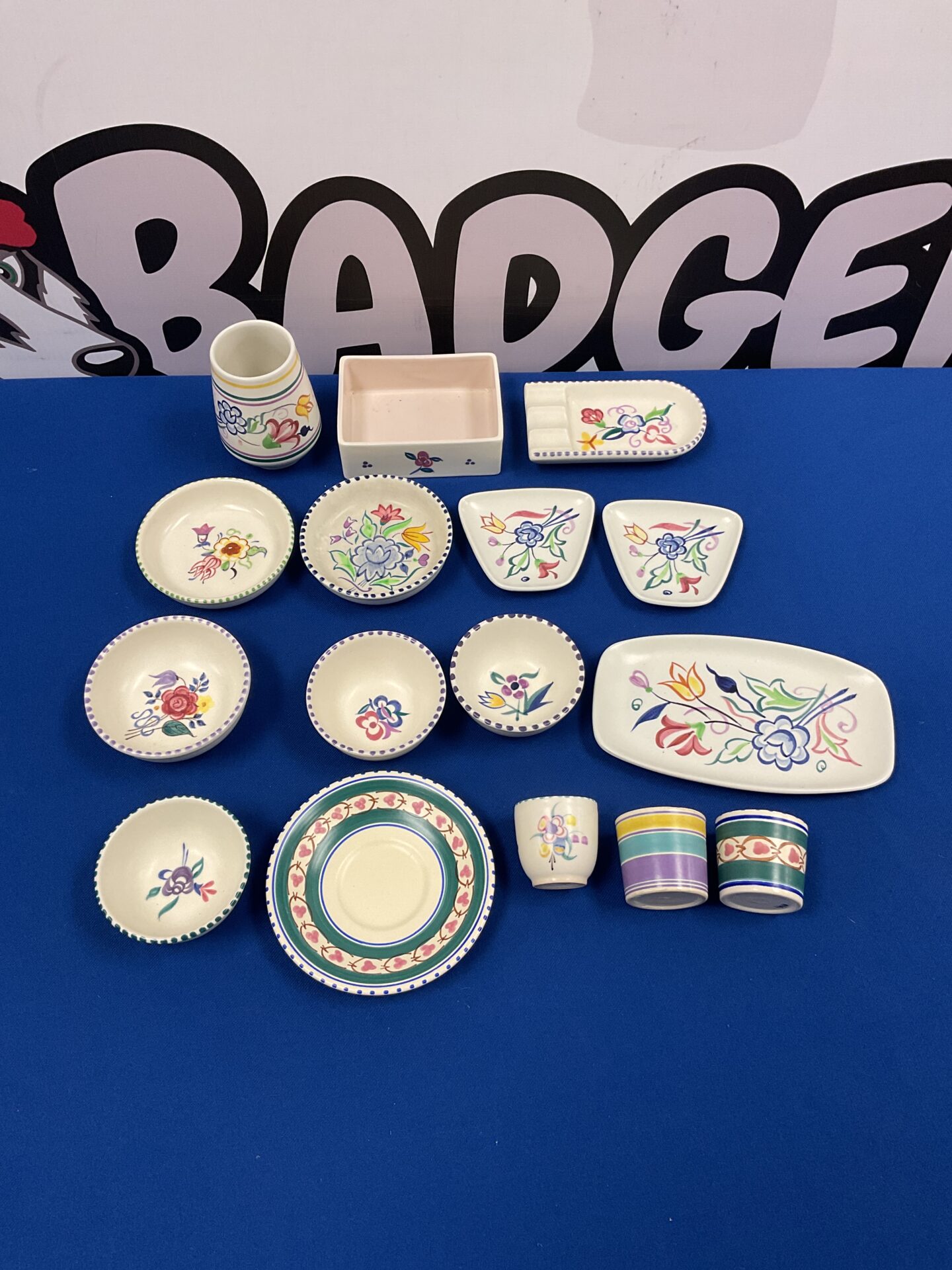A set of vibrant ceramic plates, bowls, and cups with decorative patterns.
